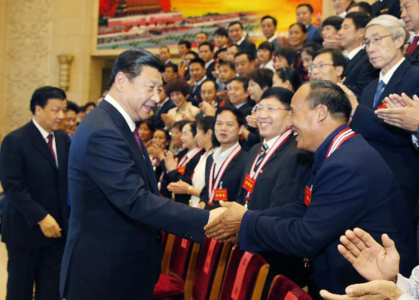 Chinese President Xi Jinping and other leaders meet with winners and nominees of the 4th selection of the 'national moral models' in Beijing, capital of China, Sept. 26, 2013. (Xinhua