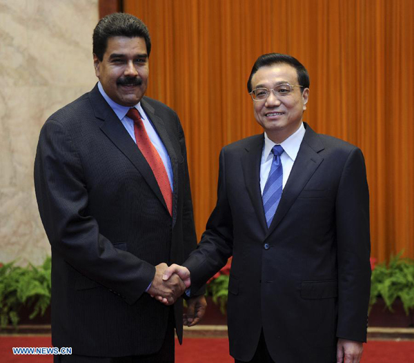 Chinese Premier Li Keqiang (R) meets with Venezuelan President Nicolas Maduro, in Beijing, capital of China, Sept. 23, 2013. (Xinhua
