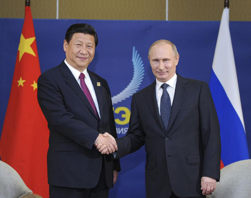 Chinese President Xi Jinping shakes hands with his Russian counterpart Vladimir Putin during the Asia-Pacific Economic Cooperation (APEC) summit.