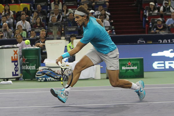 Spain’s Rafael Nadal returns to Swiss Stanislas Wawrinka en route to his 7-6 (10), 6-1 quarterfinal victory at the Shanghai Rolex Masters last night.   