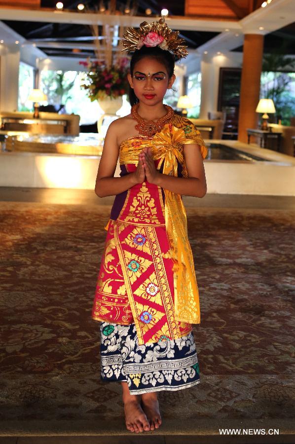 Photo taken on Oct. 7 shows a receptionist of a hotel showing a welcome gesture in Bali, Indonesia. Bali is an island and a province of Indonesia, which is located at the westernmost end of the Lesser Sunda Islands. Being a tourist heaven for decades, the island has seen a further surge in tourist numbers in recent years