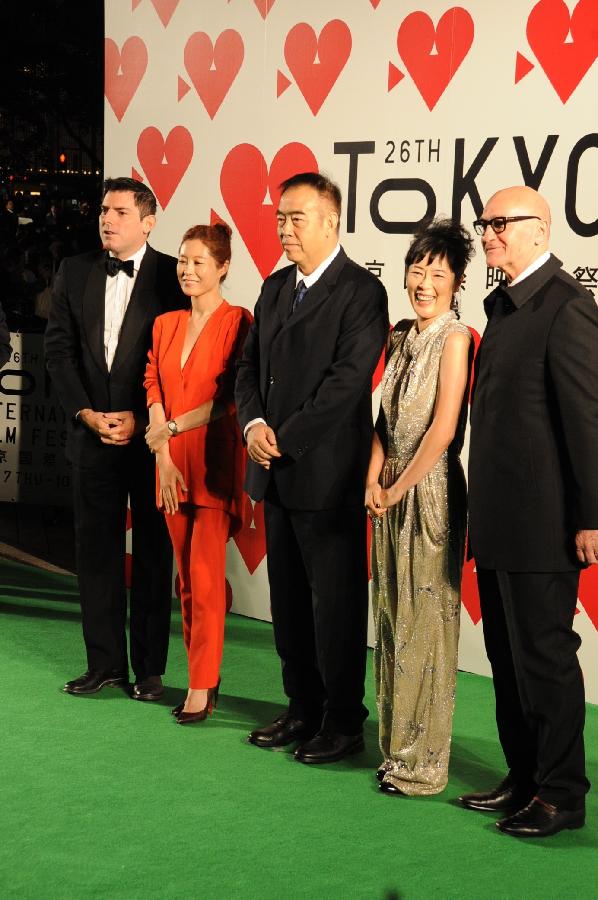 Chairman of the jury Chinese director Chen Kaige (C) pose with other jury members during the opening ceremony of the 26th Tokyo International Film Festival in Tokyo, Japan, Oct. 17, 2013.