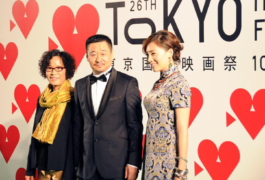 Chinese director Ning Ying (L), actor Wang Jingchun (C) and actress Chen Weihan attend the photo session during the opening ceremony of the 26th Tokyo International Film Festival in Tokyo, Japan, Oct. 17, 2013.