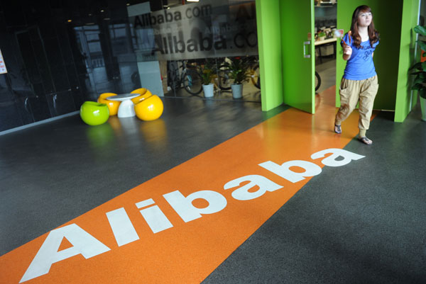 An Alibaba employee walks through a communal space at company headquarters in Hangzhou, Zhejiang province. [China Daily]