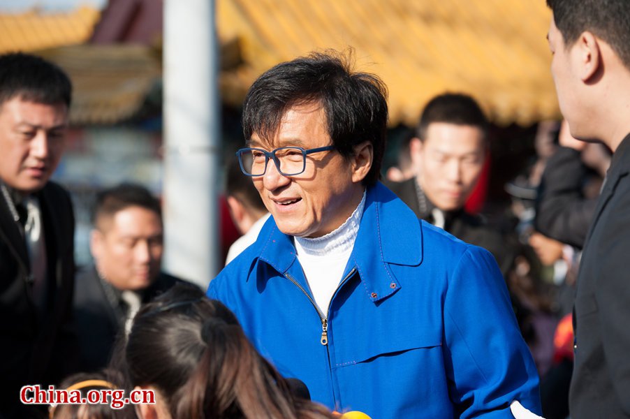 Film superstar Jackie Chan, who arrived at the lake-side scene in an unexpected manner -- by dragon boat, echoed the notion, but said he was 'too old to have a floating duck when he was young,' but his son Jaycee Chan, also known by his Chinese name Fang Zuming, did have one. [Photo / Chen Boyuan / China.org.cn]