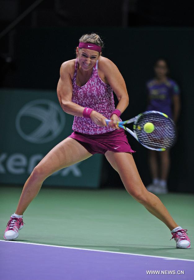 Victoria Azarenka of Belarus hits a return to Li Na of China during their WTA tennis championships match at Sinan Erdem Dome in Istanbul, October 25, 2013. Li Na won the match 2-0.