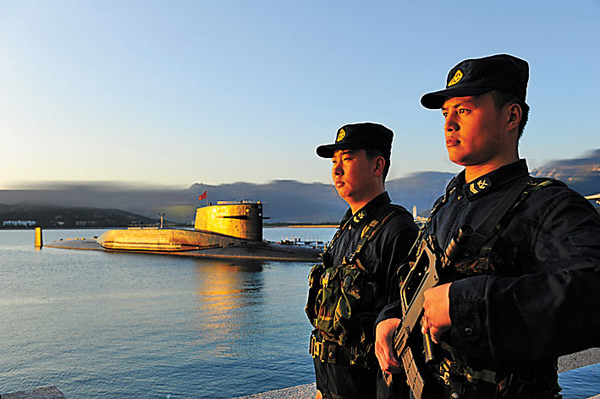 Soliders stand guard at the Qingdao submarine base. Provided to China Daily