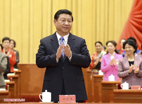 Xi Jinping, general secretary of the Communist Party of China (CPC) Central Committee, Chinese president and chairman of the Central Military Commission, applauds during the 11th National Women's Congress of China which opened at the Great Hall of the People in Beijing, capital of China, Oct. 28, 2013.
