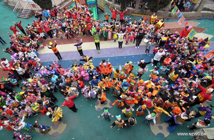 Teachers and children take part in an activity greeting the Halloween in a kindergarten in Handan City, north China's Hebei Province, Oct. 31. The World Thrift Day fell on Thursday, a day before the All-Saint's Day this year.