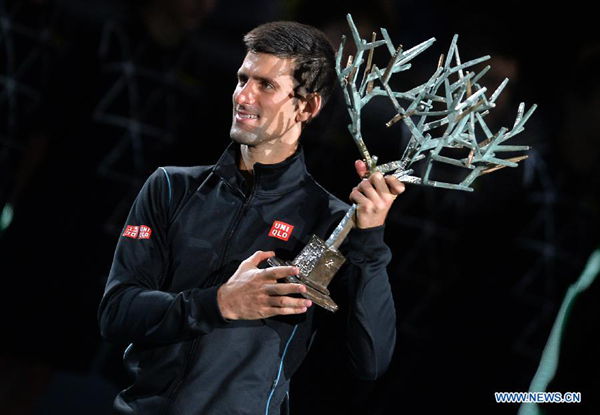 Djokovic beats Ferrer to claim the title at Paris Masters.