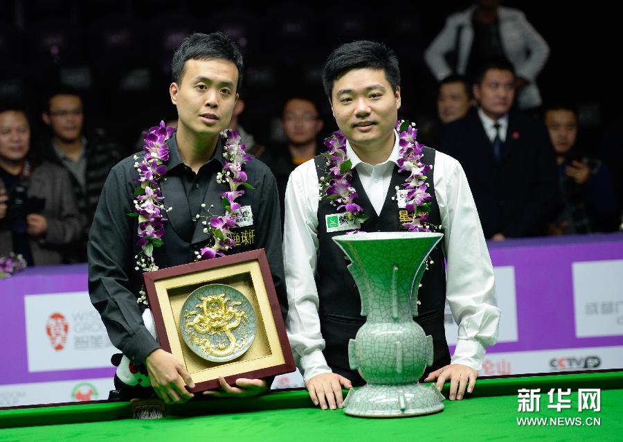 Ding Junhui defeated Hong Kong's Marco Fu 10-9 in a closely-contested final of the International Championship in Chengdu on Sunday.