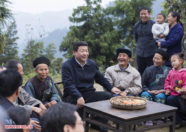 Chinese President Xi Jinping (C), also general secretary of the Communist Party of China (CPC) Central Committee and chairman of Central Military Commission, talks with local villagers and cadres at Shibadong Village in Paibi Township of Huayuan County in the Tujia-Miao Autonomous Prefecture of Xiangxi, central China's Hunan Province, Nov. 3, 2013. Xi took an inspection tour to Hunan Province from Nov. 3 to Nov. 5. (Xinhua/Wang Ye)