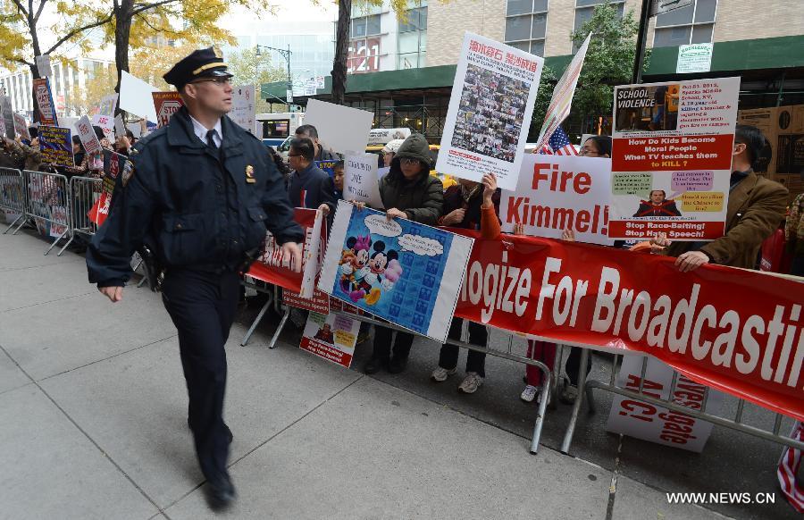 Protestors rally in front of the headquarters of the American Broadcasting Company (ABC) to protest against its rhetoric of racial discrimination in New York, the United States, Nov. 8, 2013. [Xinhua]