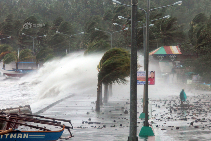 A man walks along the seaside embankment in Legaspi City of Albay Province, the Philippines, on Nov. 8, 2013.