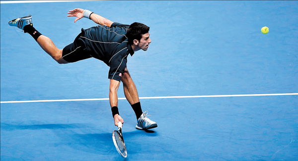 Novak Djokovic of Serbia plays a shot to Spain's Rafael Nadal during the singles final of the ATP World Tour Finals at the O2 Arena in London on Monday. 