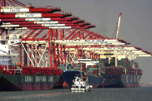 A cargo vessel loads at the container berth of Tianjin Port. China's next round of reform will focus on an all-round marketization so as to establish an open, unified and orderly market system. [Photo: Liu Haifeng]