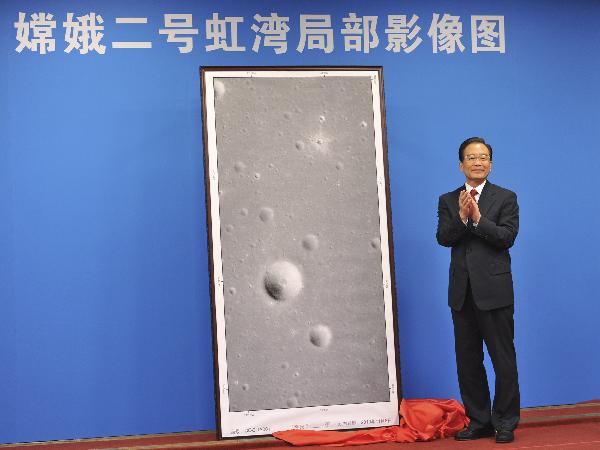 Chinese Premier Wen Jiabao attends an unveiling ceremony for pictures of the moon's Sinus Iridum, or Bay of Rainbows, taken and sent back by the Chang'e-2, China's second lunar probe, in Beijing, capital of China, Nov. 8, 2010. (Xinhua