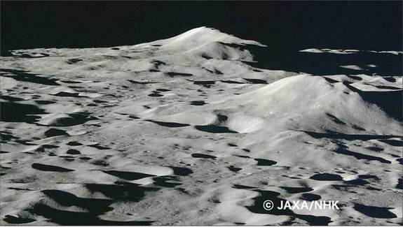 Just moments before impact, Kaguya's HD camera took this picture. Lunar hills loom in a seemingly distant background.[Space.com]