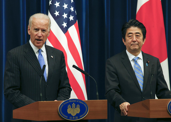 US Vice-President Joe Biden (L) holds a joint press conference with Japanese Prime Minister Shinzo Abe in Tokyo, on Dec 3. Biden arrived in Tokyo late on Monday and his weeklong trip in East Asia will also take him to China and South Korea.[Photo/Xinhua]    