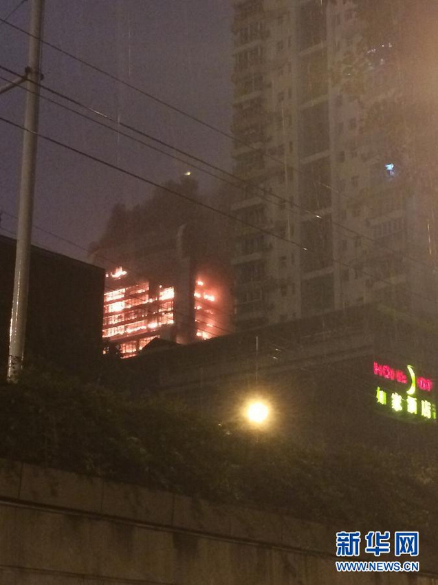Fire was raging in a high-rise building in downtown Guangzhou, capital of south China's Guangdong Province, on Sunday night. [Photo/Xinhua]