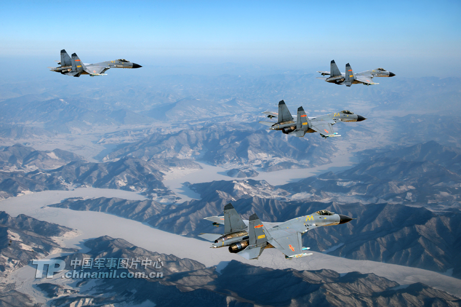 The J11B jet fighters of the People’s Liberation Army Air Force conduct an exercise on Dec. 19, 2013, in north China. [Photo: Cao Zhanli/tp.chinamil.com.cn ]