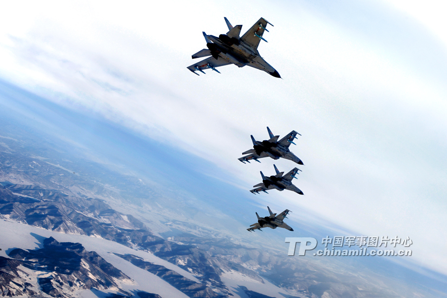 The J11B jet fighters of the People’s Liberation Army Air Force conduct an exercise on Dec. 19, 2013, in north China. [Photo: Cao Zhanli/tp.chinamil.com.cn ]