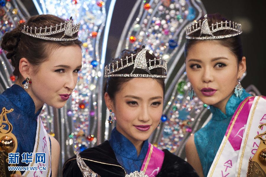 Miss Asia 2013 winner Fang Xingtong (C) poses during the awarding ceremony of Miss Asia Pageant 2013 final in south China's Hong Kong, Dec. 21, 2013. (Source:Xinhuanet.com)
