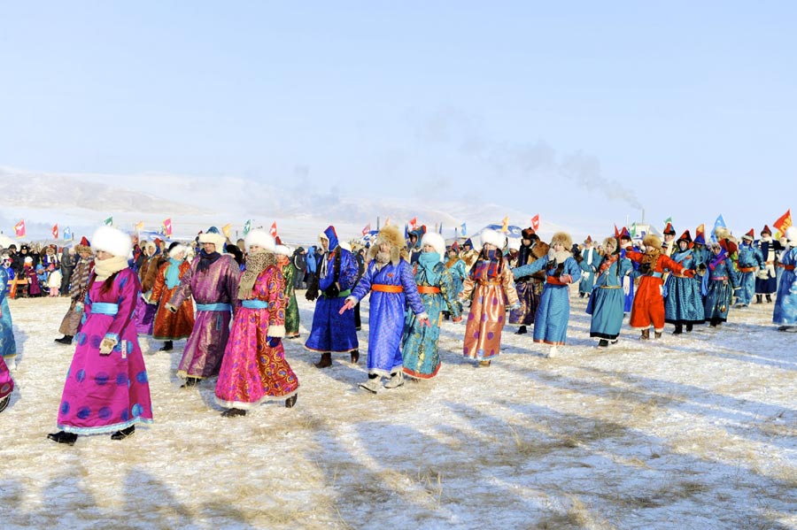 The 14th Ice and Snow Naadam festival kicks off at the Chen Barag Banner in Hunlunbuir League of the Inner Mongolia autonomous region on December 23, 2013. A ceremony worshipping fire, performance, dancing and singing along with traditional sports competitions will be held throughout the festival.[Photo/Xinhua]