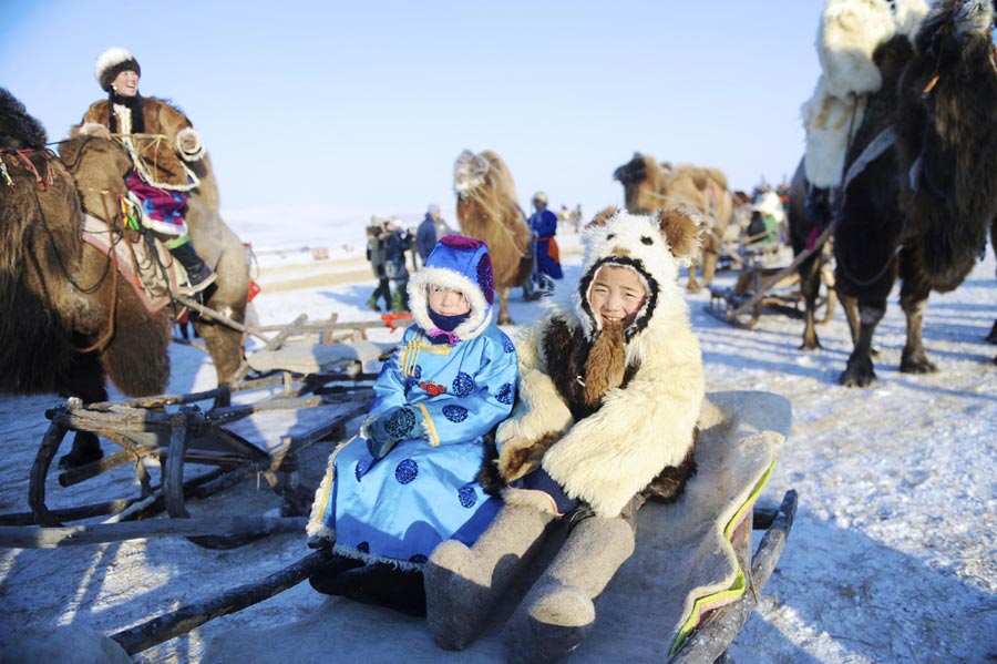 The 14th Ice and Snow Naadam festival kicks off at the Chen Barag Banner in Hunlunbuir League of the Inner Mongolia autonomous region on December 23, 2013. A ceremony worshipping fire, performance, dancing and singing along with traditional sports competitions will be held throughout the festival.[Photo/Xinhua]