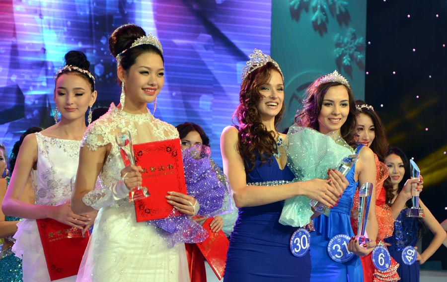 40 beauty contestants who stood out from the previous rounds competed in the final round of the international beauty competition. The beauty pageant was comprised of three categories including traditional folk costumes, swimsuit and evening wear. In the end, Butykova Tamara from Russia was crowned the champion. Pan Xiaotong and Chen Xi, both from China, finished second and third.[Photo by Bi Nan/chinadaily.com.cn]