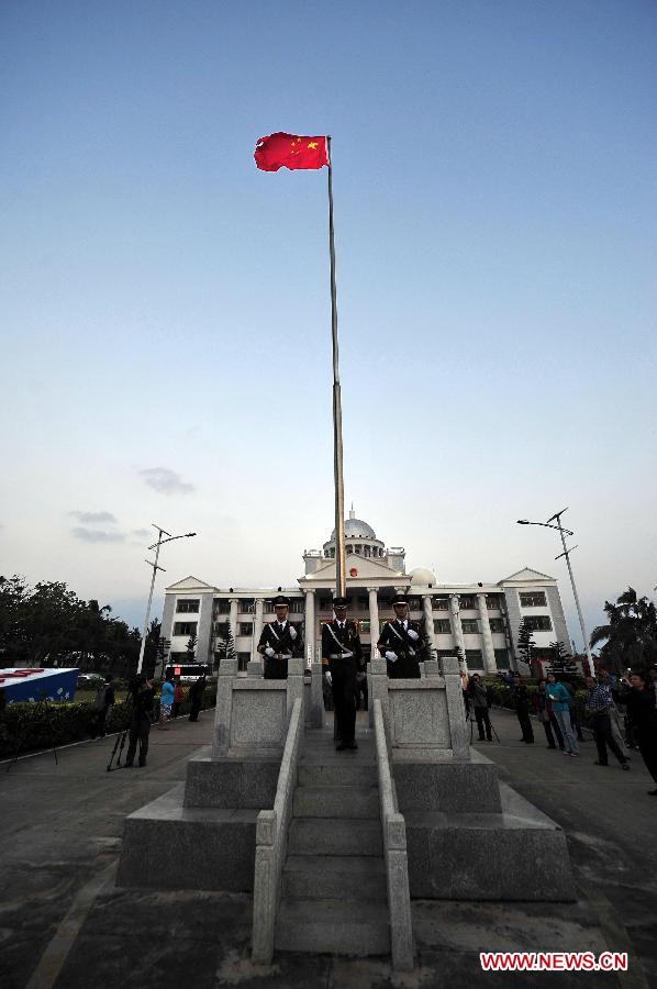 A national flag raising ceremony is held at Yongxing Island of Sansha City, south China's Hainan Province, to welcome the coming of the new year, on Jan. 1, 2014. (Xinhua/Guo Cheng)