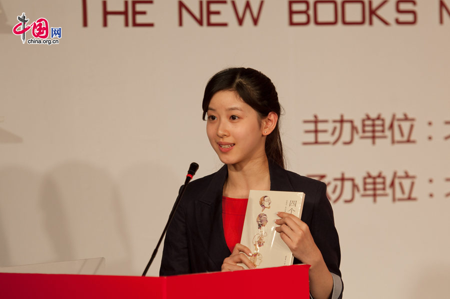 Zhang Zetian, also know as Milk Tea Sister, now an undergraduate at Tsinghua University, promotes a book titled &apos;Four Chinese&apos; on at China International Exhibition Center in Beijing on Friday, Dec. 10. [Photo by Chen Boyuan / China.org.cn]