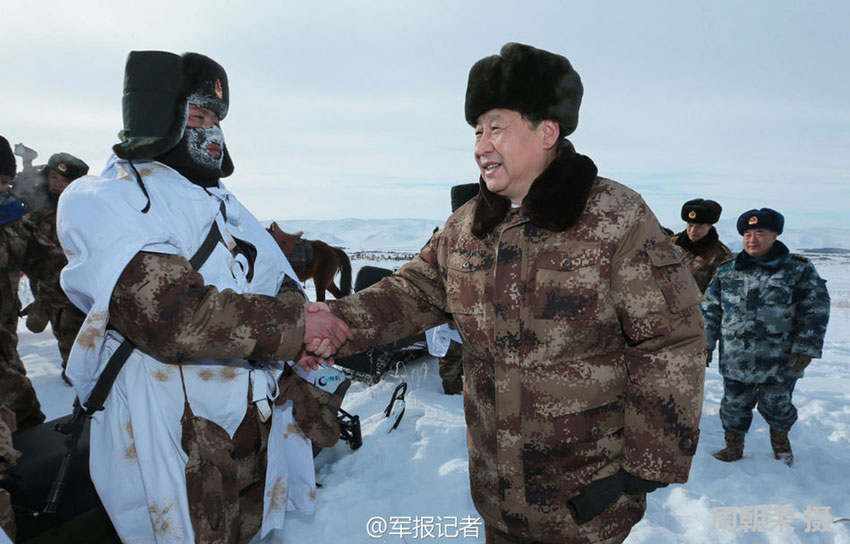 Chinese President Xi Jinping makes an inspection visit to the garrison troops based at Aer Mountain in the Inner Mongolia Autonomous Region on Sunday morning, January 26, 2014. Xi extended new year greetings to the soldiers who patrol in chilly snowy weather at 30 degrees Celsius below zero. [Photo: PLA Daily]