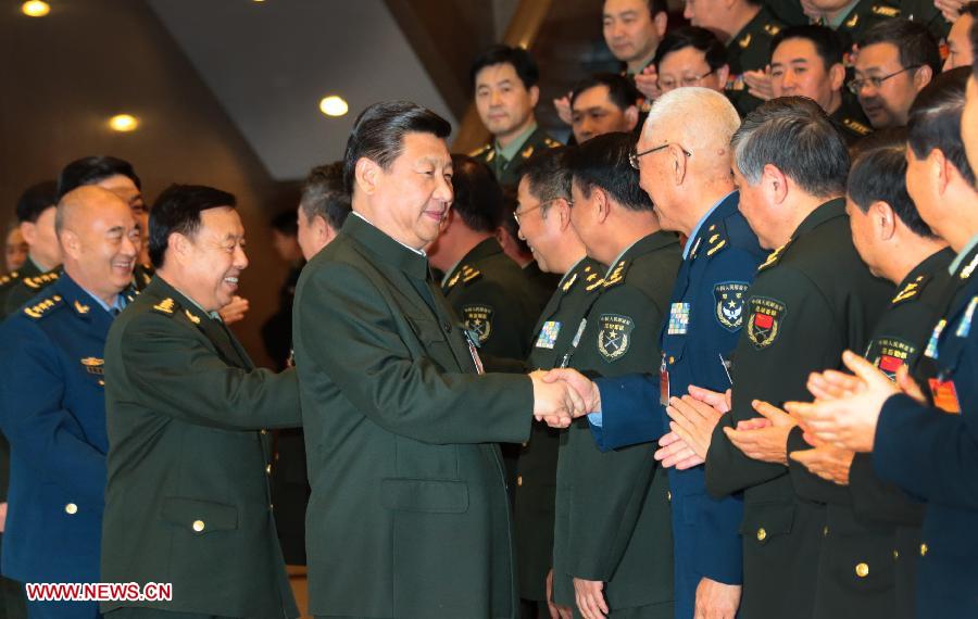 Chinese President Xi Jinping (C), also general secretary of the Communist Party of China (CPC) Central Committee and chairman of the Central Military Commission, shakes hands with delegates attending the People's Liberation Army (PLA) logistics work conference, in Beijing, capital of China, Nov. 18, 2013. [Photo/Xinhua]