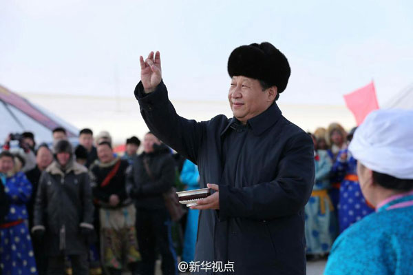 Chinese President Xi Jinping attends the winter Nadam Fair in Xilingol, north China's Inner Mongolia Autonomous Region on Monday, January 27th, 2014. Xi extends new year greetings to the people and wishes them a successful year of the horse. The Nadam Fair is a mass traditional Mongolian festival where people celebrate harvests and pray for good luck. The winter Nadam Fair is usually held from December to January. [Photo/Xinhua]