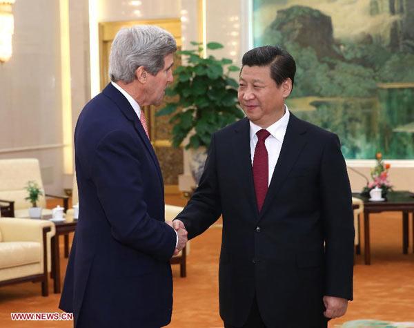Chinese President Xi Jinping (R) meets with visiting U.S. Secretary of State John Kerry in Beijing, capital of China, Feb. 14, 2014. [Xinhua/Pang Xinglei]