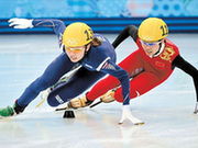 South Korea's Kim Alang (left) and China's Li Jianrou compete in the women's short track 3000m relay final at the Sochi Winter Olympics yesterday. South Korea won the gold.