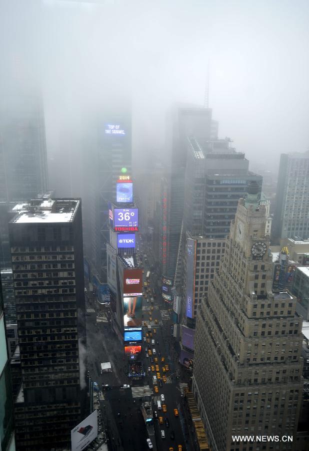 A dense fog covered New York City through Friday afternoon, causing some departure delays at airports in and near the city