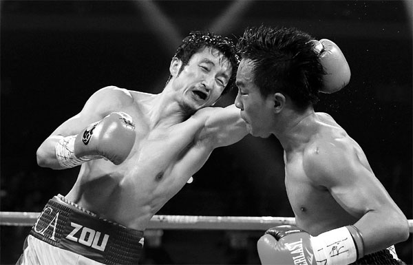Zou's KO victory boosts shot at world title in Nov