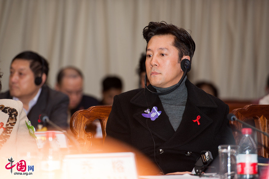 Cai Guoqing, a famous singer and HIV/AIDS activist attends the Zero Discrimination Day event.The UNAIDS, China Red Ribbon Foundation and Hanergy jointly launch the &apos;Zero Discrimination Day&apos; advocacy event in Beijing on Thursday, Feb. 27, 2014. [Photo by Chen Boyuan / China.org.cn]