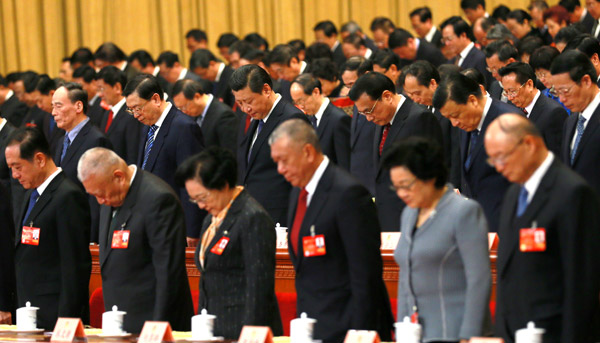 Top leaders including President Xi Jinping and Premier Li Keqiang join members of the National Committee of the Chinese People's Political Consultative Conference to mourn those who died in Saturday's terrorist attack in Kunming, capital of Yunnan province, as the annual session of the country's top political advisory body opens in Beijing on Monday. 