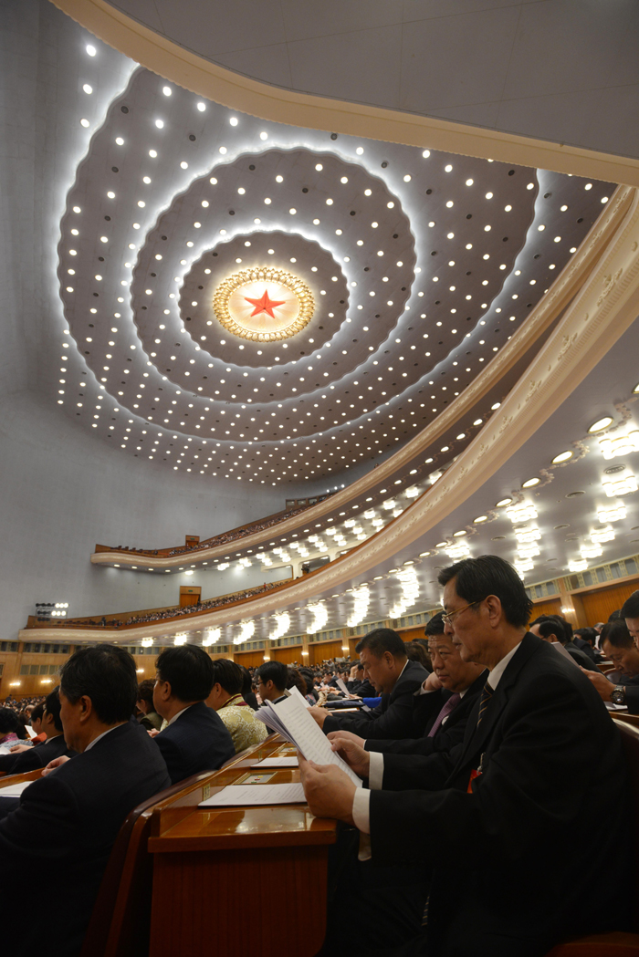 The National People&apos;s Congress holds a plenary meeting on Monday afternoon. Zhou Qiang, president of the Supreme People&apos;s Court (SPC), delivers a report on the SPC&apos;s work. [Photo/Xinhua]