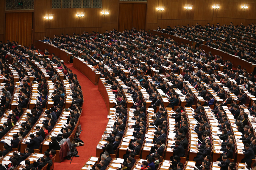 The National People's Congress holds a plenary meeting on Monday afternoon. Zhou Qiang, president of the Supreme People's Court (SPC), delivers a report on the SPC's work. [Photo/Xinhua]