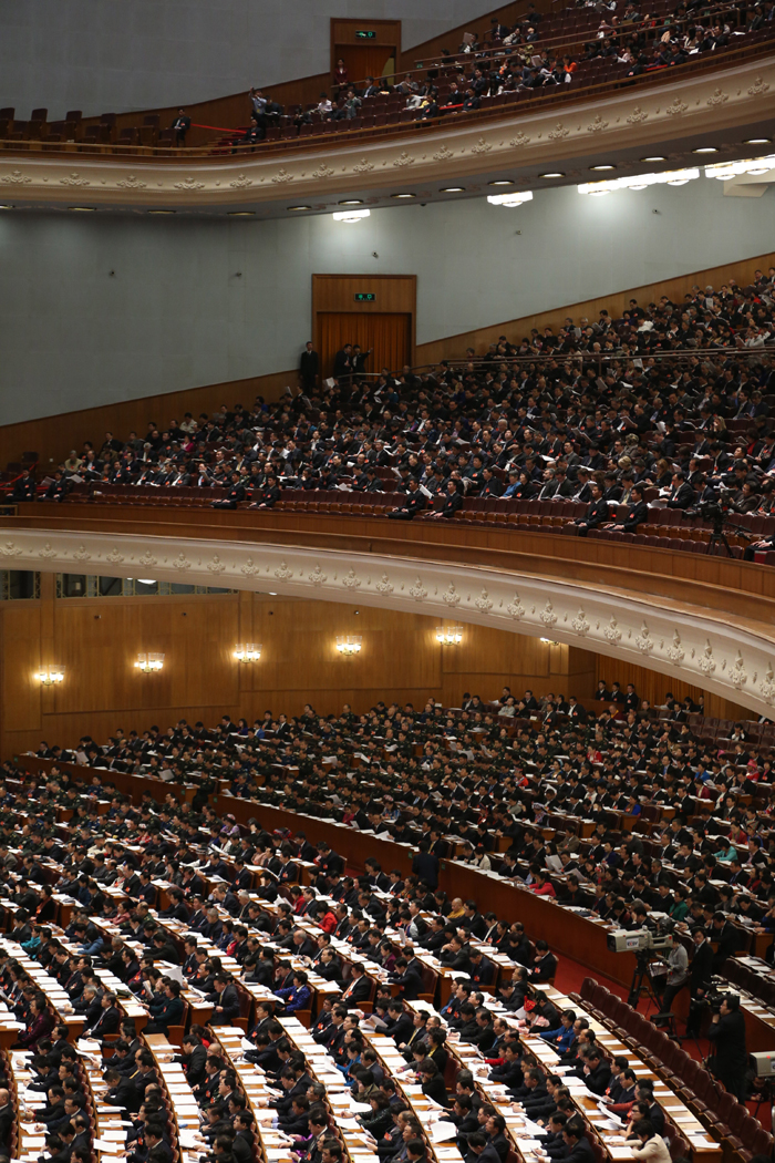 The National People's Congress holds a plenary meeting on Monday afternoon. Zhou Qiang, president of the Supreme People's Court (SPC), delivers a report on the SPC's work. [Photo/Xinhua]