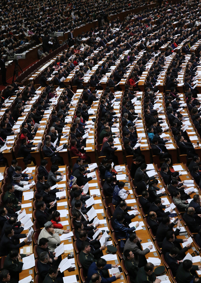 The National People&apos;s Congress holds a plenary meeting on Monday afternoon. Zhou Qiang, president of the Supreme People&apos;s Court (SPC), delivers a report on the SPC&apos;s work. [Photo/Xinhua] 