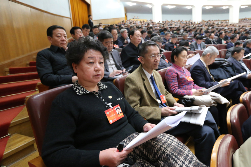 The National People&apos;s Congress holds a plenary meeting on Monday afternoon. Zhou Qiang, president of the Supreme People&apos;s Court (SPC), delivers a report on the SPC&apos;s work. [Photo/Xinhua] 