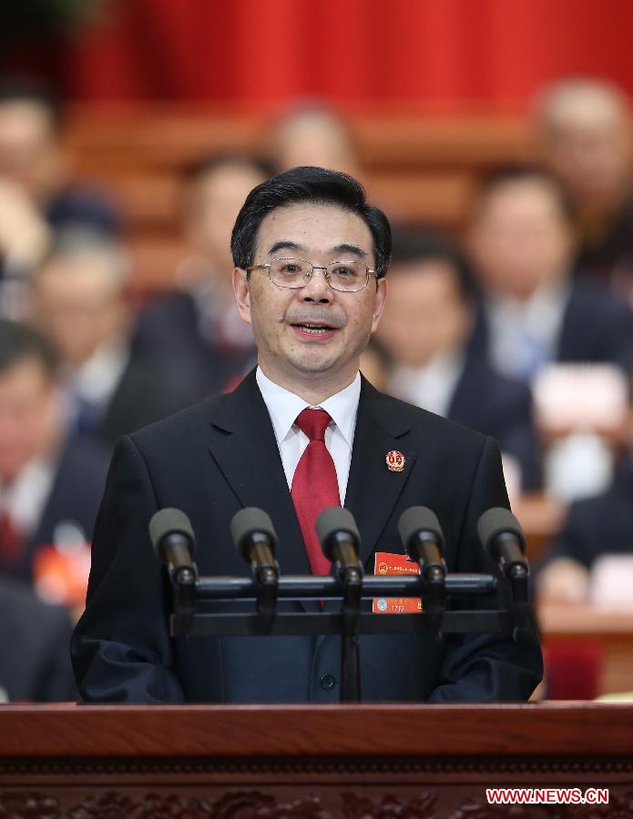 Zhou Qiang, president of China's Supreme People's Court (SPC), delivers a report on the SPC's work at the third plenary meeting of the second session of China's 12th National People's Congress (NPC) at the Great Hall of the People in Beijing, capital of China, March 10, 2014.[Photo/Xinhua]