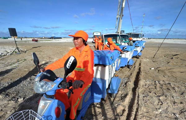 Workers assist in the operation of a wastewater treatment plant on Yongxing Island. Xiao Jie, mayor of Sansha, made a proposal to establish a rescue base to deal with offshore emergencies, which often involve fishermen. [Photo/Xinhua]