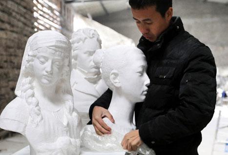 A sculpted bust of a woman from classical times - or so it seems, until artist Li Hongbo grabs her head and starts to pull. 