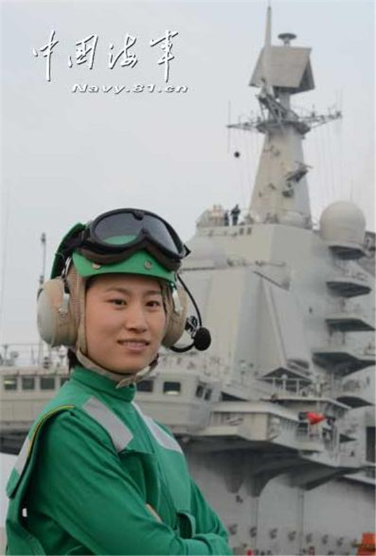 A member of the first-generation of female sailors on board aircraft carrier Liaoning works on deck. [Photo/navy.81.cn] 